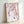 Contemplative floral art print depicting graceful cherry blossom branches rendered in soft watercolor hues of blush pink and muted rose.