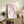 Peaceful spring-inspired wall art featuring hand-painted style cherry blossom branches in blush pink, deep rose, and charcoal gray on white.