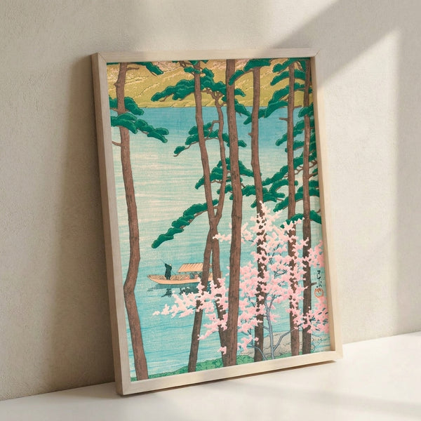 Framed nature-inspired poster in Japanese woodblock tradition showing a peaceful lakeside composition with flowering cherry trees, coniferous forest, and a distant boat in contemplative sage and pink tones.