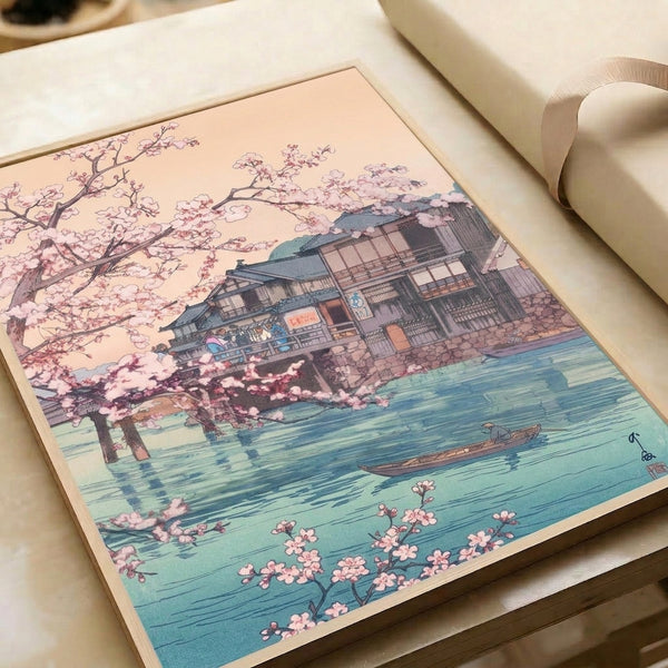 Japanese-style poster art capturing a quiet moment at a sakura-lined river with a small boat near a traditional building, rendered in serene pale pink, cream, and turquoise palette.