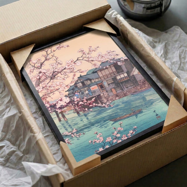 Ukiyo-e aesthetic wall print: contemplative riverside teahouse framed by blooming cherry blossoms with a boat on the water, in muted charcoal, pink, and sage tones.