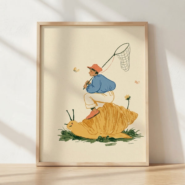 Whimsical vintage-style framed poster of a child riding a large snail through wildflowers, holding a butterfly net, rendered in soft cream, blue, coral, and golden-yellow tones with forest-green accents.