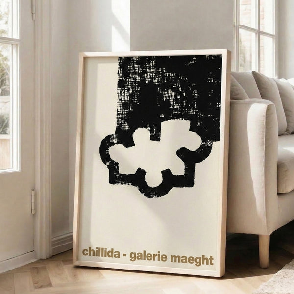 Minimalist modern poster with bold black abstract shapes on cream ground, suggesting three-dimensional form in elegant, contemplative style.