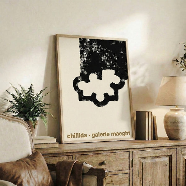 Framed Bauhaus-style print featuring abstract geometric composition in black and cream, evoking sculptural volume with minimalist restraint.
