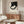 Sophisticated abstract art print with cream base and black geometric forms arranged in contemplative, minimalist sculptural arrangement.