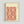 Traditional Japanese scroll pattern wall art with symmetrical decorative tile-inspired motifs in warm terracotta and off-white, rendered in woodblock style.