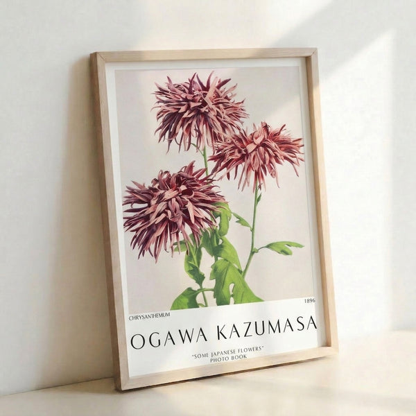 Serene Impressionist chrysanthemum artwork framed on wall, showcasing layered petals in mauve and pale pink with graceful green foliage against a cream backdrop.