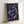 Minimalist geometric poster displaying fragmented circles in navy blue and coral red, creating a contemplative, balanced abstract composition on cream.