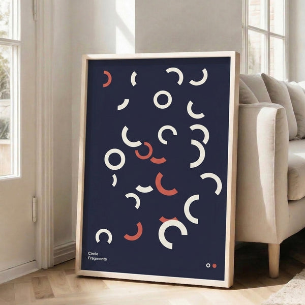Bauhaus study print with navy and coral circular forms deconstructed into thoughtful arc segments on a cream field, framed wall art.