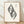 Japanese woodblock-style line art poster featuring an ornamental leaf and feather crest pattern in black on cream background, framed on wall.