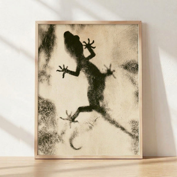 Minimalist line art framed poster of a gecko in black and charcoal strokes on cream background, with an experimental meditative quality.
