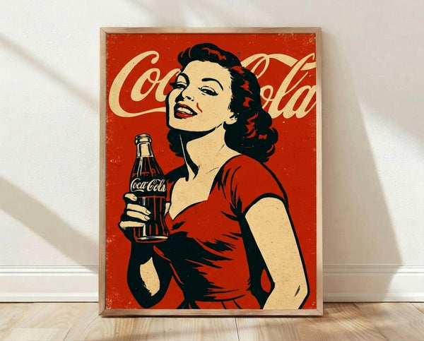 Framed retro pop art poster of a glamorous 1950s pin-up woman with a Coca-Cola bottle, rendered in bold red, cream, and black tones.