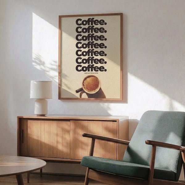 Coffee lover's art print in Bauhaus aesthetic showing playful repeated text typography in cream and black on a tan-toned background, hung as a framed poster.