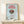 Contemporary coffee-themed wall art with a geometric coffee cup design in red, brown, and soft blue tones, conveying an inviting yet understated elegance.