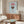 Modern minimalist print featuring a coffee cup illustration in muted red and brown on soft blue and beige, bringing calm, coffee-culture-inspired decor to any room.