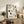 Line art coffee poster in muted cream and gray with brown and orange accents, capturing a peaceful brewing ritual in minimalist style.