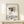 Contemporary line art print with cozy coffee cup imagery and turtle motif in cream and tan, shown framed in an interior setting.
