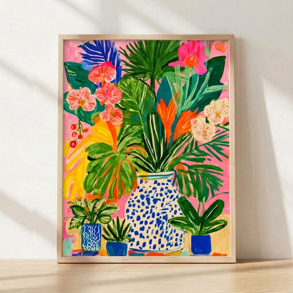 Vibrant tropical flowers in shades of pink, orange, and yellow arranged in a blue vase with green foliage, modern boho-style botanical art print on a wall.