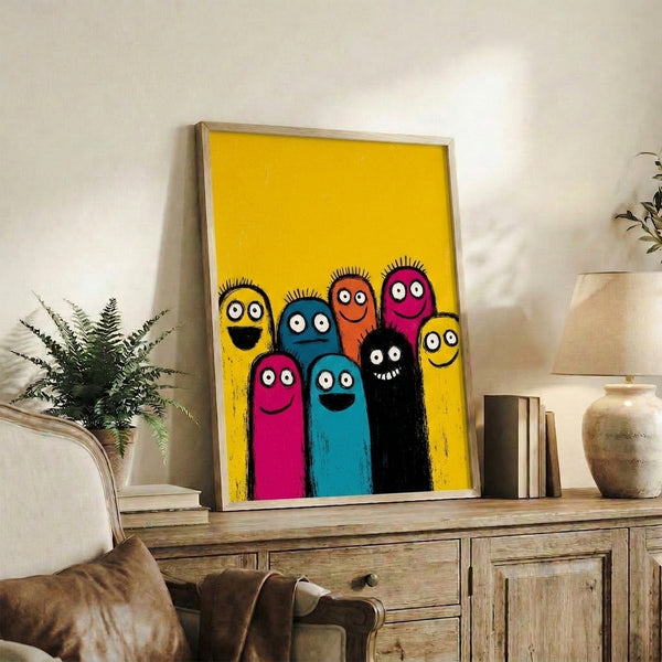 Bright pop art character illustration with a cheerful monster family design in magenta, teal, yellow, and orange, presented as a framed wall poster.