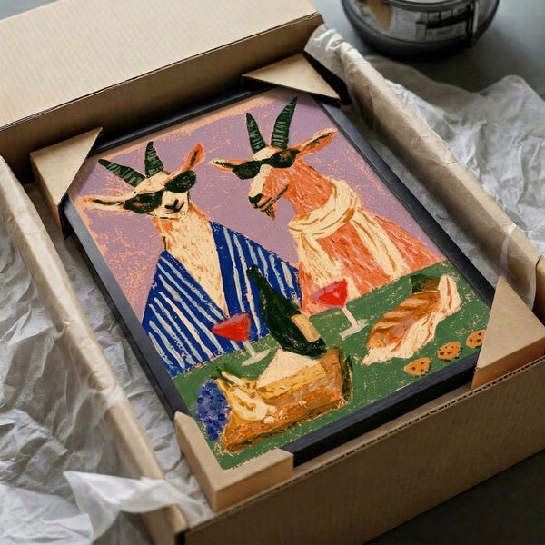 Boho retro art print showing a fun, sophisticated goat at a wine picnic scene with bread and grapes, hand-drawn in a folk art style with navy, sage green, cream, and orange hues.