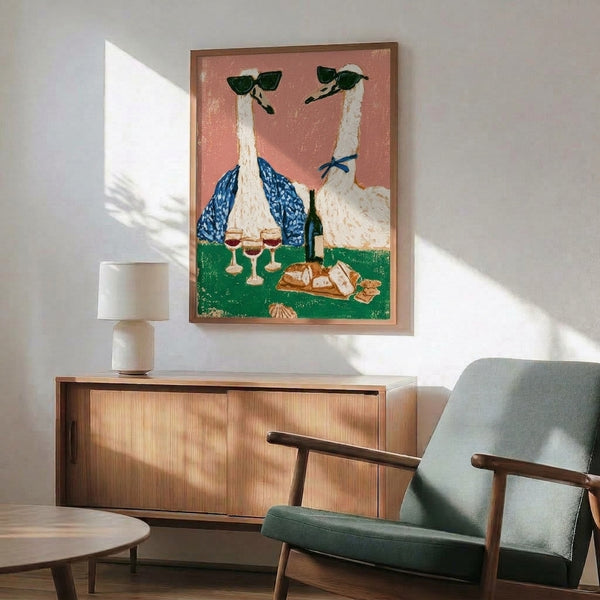 Vintage-inspired wall art depicting geese and ostrich characters in sunglasses at a picnic with wine bottle and cheese, boho style with terracotta, cream, and navy color palette.