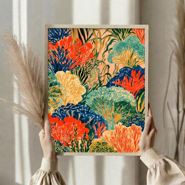 Serene ocean-themed art print with an elegant seahorse nestled in a lush garden of coral and anemones rendered in vibrant reds, navy blues, and seafoam greens, creating a coastal aesthetic on a framed poster.