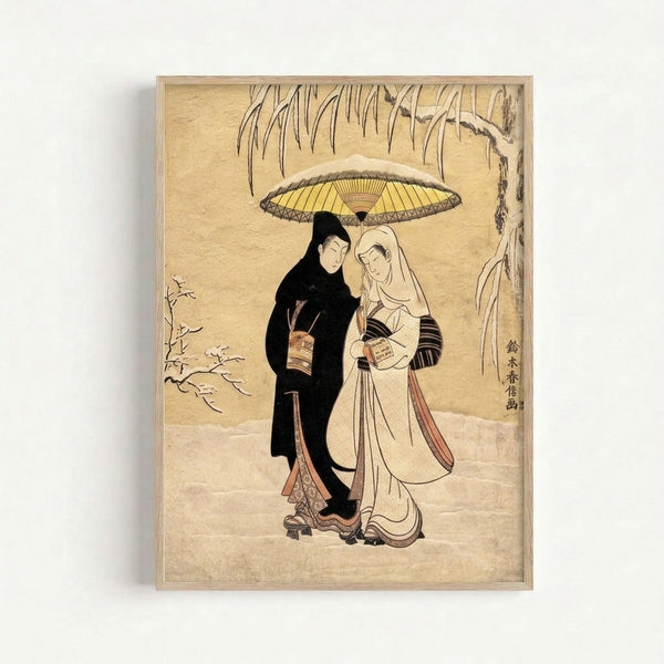 Framed ukiyo-e style artwork depicting a man and woman huddled together under an umbrella during snowfall, featuring traditional woodblock technique in muted cream and rust hues.