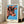 Vibrant pop art cow portrait in orange and blue hues with bright accents, framed as a bold statement art print for modern interiors.