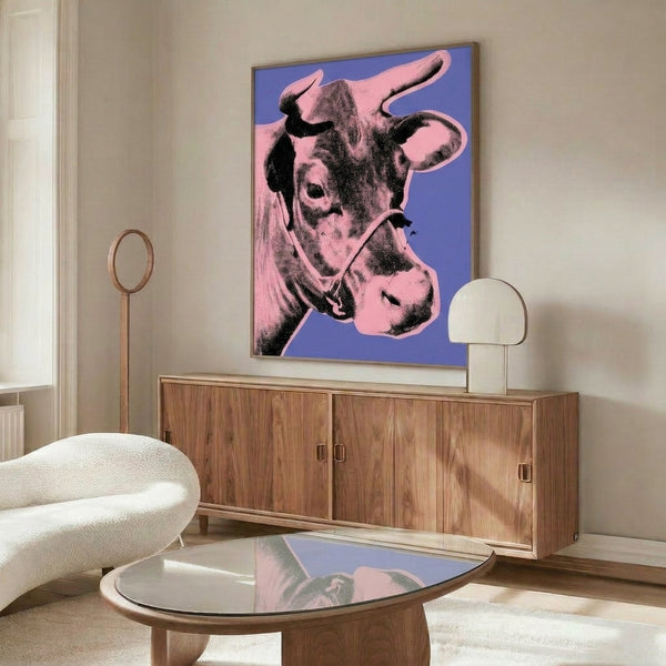 Contemporary pop art wall print featuring a pink cow silhouette on purple background, executed in bright, eye-catching color contrast.