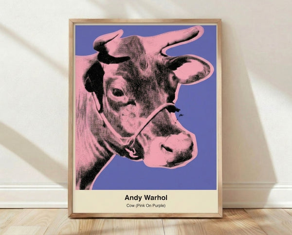 Bold pop art poster featuring a cow head in hot pink against a vibrant purple background with black outlines, showcasing playful modern art style.