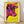 Pop art poster featuring a stylized cow head in bright pink against a vibrant yellow background, framed on a wall.