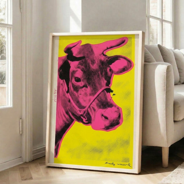 Vibrant pop art poster showcasing a cow face rendered in vivid pink pigmentation set against warm yellow space.