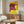 Modern art poster with a graphic pink cow illustration against a bright yellow background, displayed as framed wall décor.