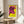 Modern pop art framed poster depicting a stylized cow portrait in pink and yellow with graphic black accents, gallery-style wall display.