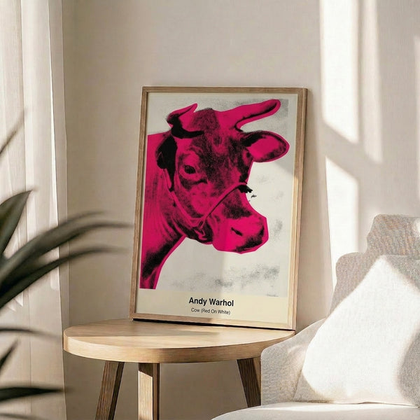 Contemporary pop art framed poster featuring a stylized cow face in red, white, and black with Bauhaus geometric sensibility.