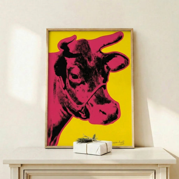 Vibrant pop art poster displaying a red cow portrait against a cheerful yellow field, perfect for modern interior décor.