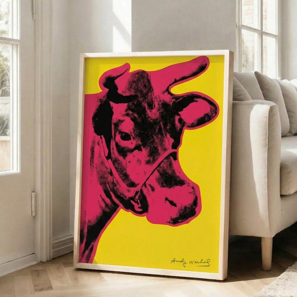 Eye-catching wall art print showing a cow in deep red tones set against a sunny yellow background in pop art tradition.