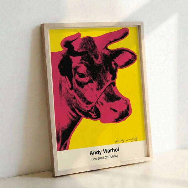 Vibrant pop art cow head design in contrasting red and yellow tones with black linework, creating a subversive yet cheerful wall artwork.