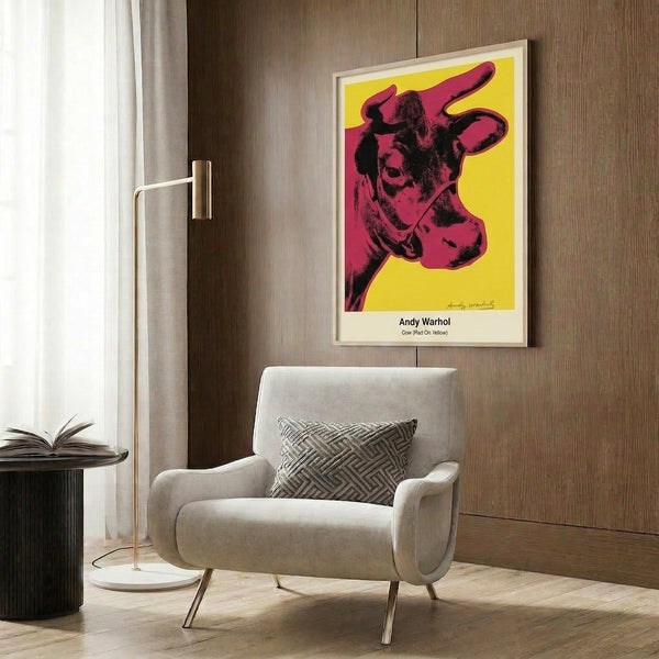 Framed pop art wall poster featuring a stylized bovine head in vivid red, yellow, and black, exemplifying bold contemporary art with retro appeal.
