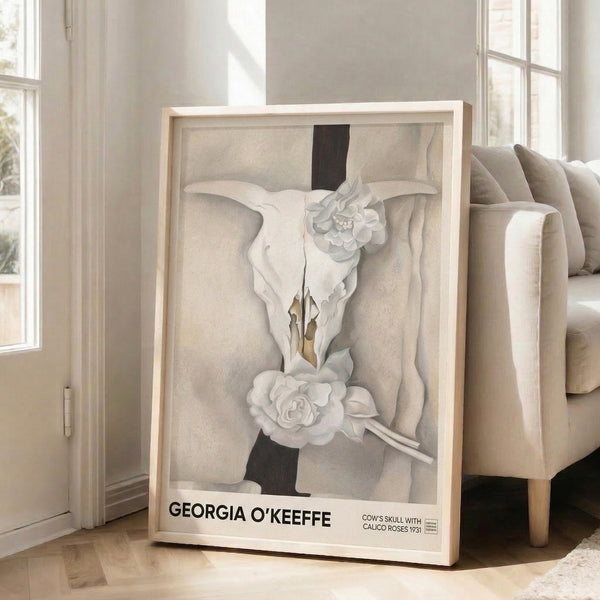 Contemplative art print with a centered skull motif surrounded by delicate calico blossoms rendered in soft neutrals and blacks on cream.