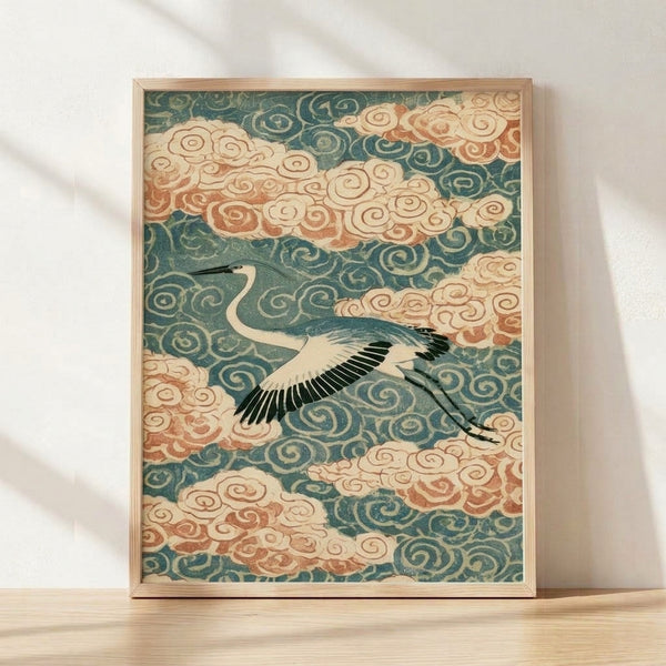 Serene Japanese woodblock print of a crane in flight among layered clouds, rendered in teal, cream, rust, and gold tones with black linework, framed on a wall.