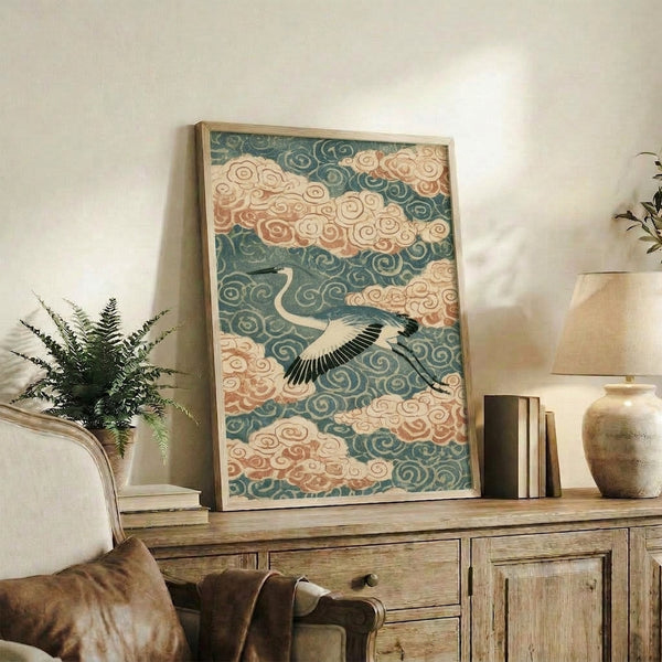 Framed poster of a solitary crane gliding among clouds in the Japanese woodblock tradition, combining serene brushwork with a sophisticated color scheme of teal, cream, rust, and gold.