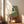 Cream and forest green Japanese-inspired poster featuring an elegant crane amid floating clouds, minimalist wabi sabi design in calm woodland palette.