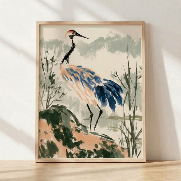 Serene Japanese watercolor poster of a crane standing in misty wetlands among reeds, rendered in soft greens and dusty blues with coral-orange accents, framed on a wall.