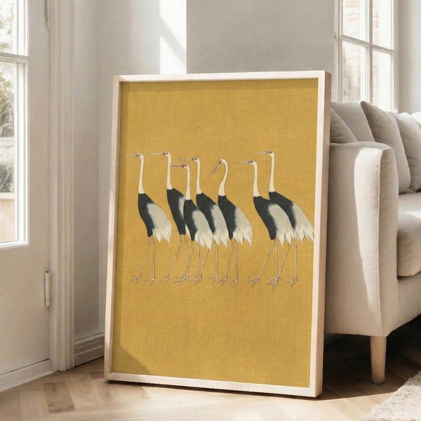 Meditative wall art depicting cranes in gold and black with minimalist japandi styling, inspired by traditional Asian woodblock techniques.