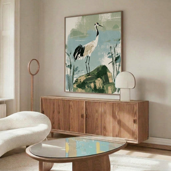 Japandi wall art featuring a graceful crane amid water and reeds in a minimalist composition, dominated by calming sage green and pale blue tones with cream and black details.
