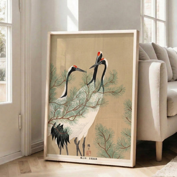 Traditional Japanese woodblock print depicting a crane on a pine branch, featuring serene cream and black tones accented with soft green and red.
