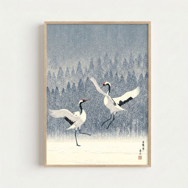 Minimalist winter landscape art inspired by Ito Jakuchu, depicting graceful cranes dancing in snow with meditative mood, framed on wall in cool blues and creams.