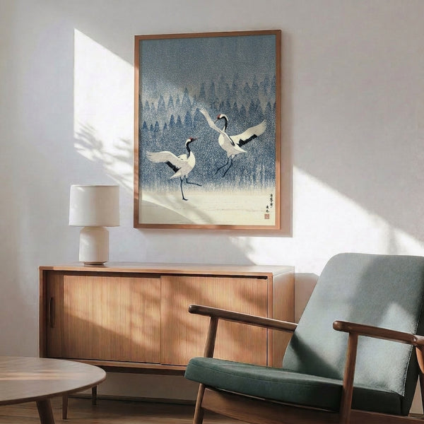 Traditional Japanese woodblock aesthetic poster depicting two cranes in winter snowfall, serene and meditative with navy, slate blue, and cream color scheme.