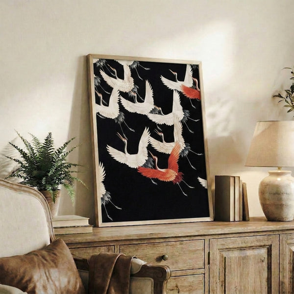 Japanese crane wall art featuring birds in flight within a patterned composition, done in classic woodblock aesthetic with black, cream, and warm red tones.